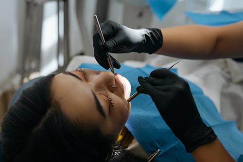 Free Close-up Photo of Dentist Examining Patient's Teeth  Stock Photo
