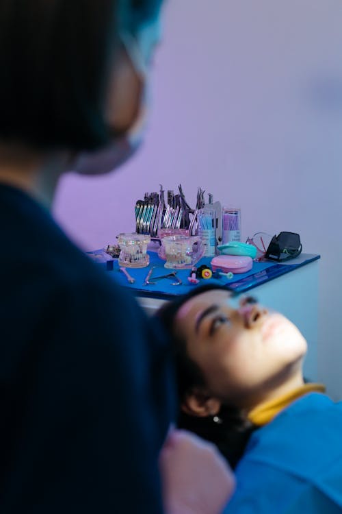 Selective Focus Photo of Dental Tools on a High Table 