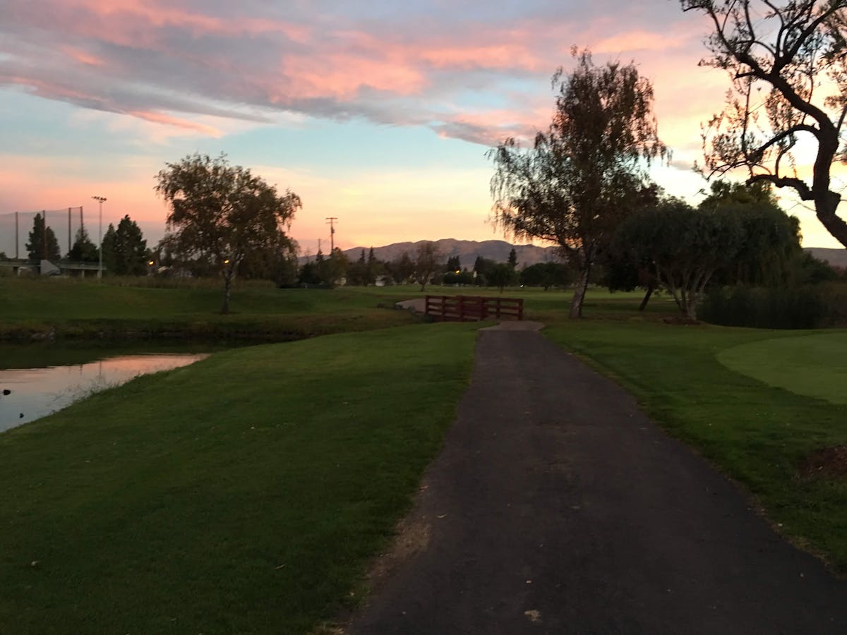 Older adult doing breathing exercises with a therapist after pneumonia