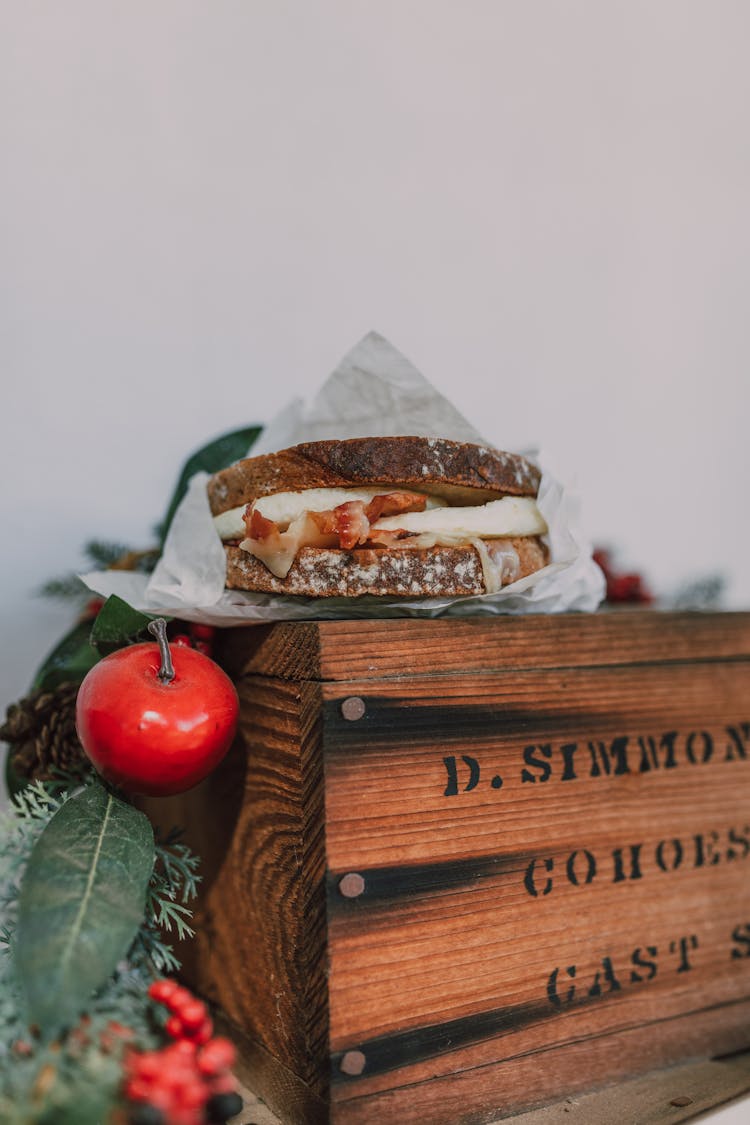 A Sandwich Over A Wooden Box