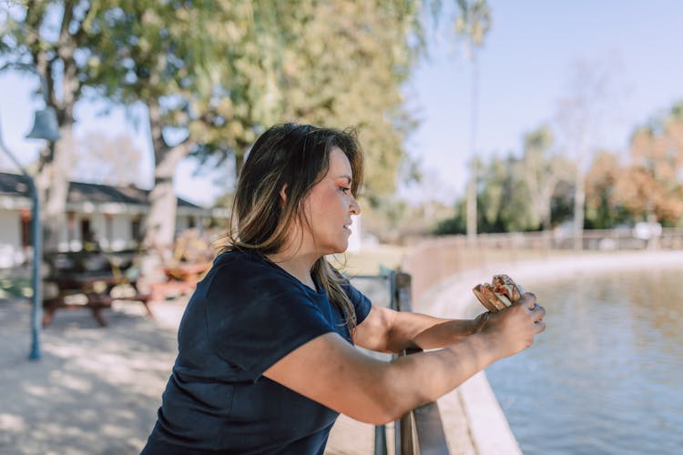 Woman Holding A Sandwich 