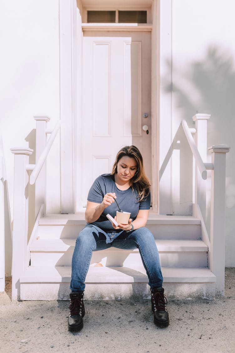 A Woman Eating Take Away Food