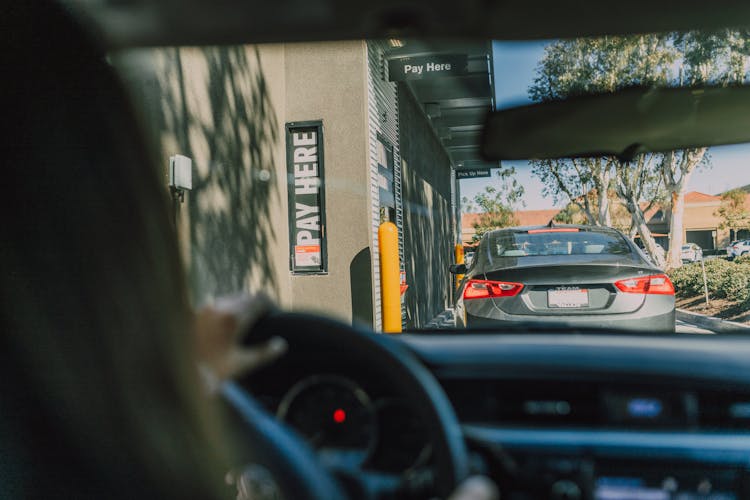 Driver Inside A Car On A Drive Thru 