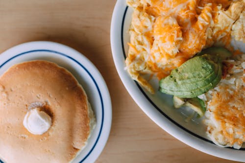 Free Healthy Dish with Sliced Avocados and a Pancake Stock Photo