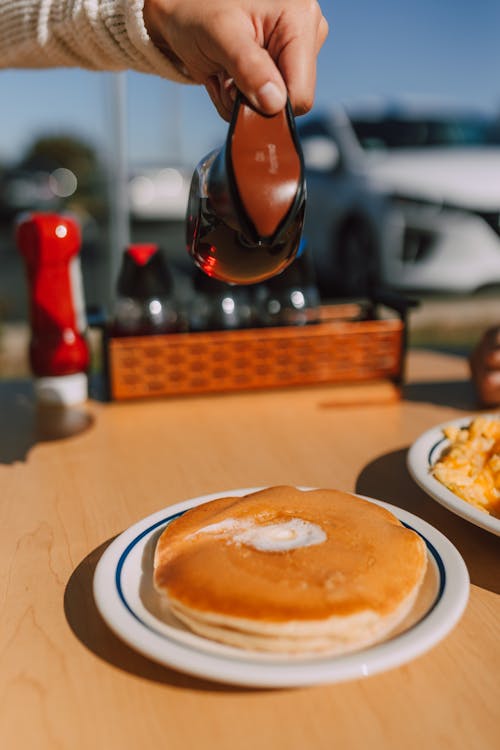 Free Pouring of Maple on a Pancake  Stock Photo