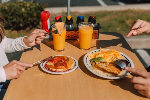Free Two People having Delicious Breakfast  Stock Photo