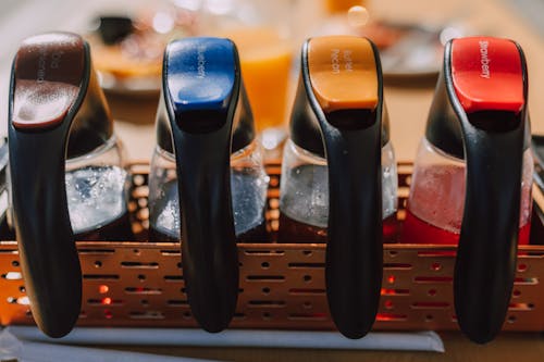 Close-up Photo of Assorted Colored Bottles