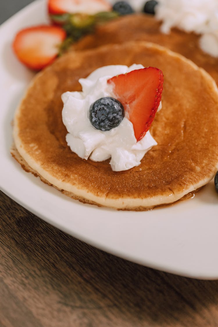 A Strawberry Pancake With Whipped Cream