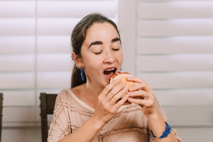 A Woman Eating Sandwich