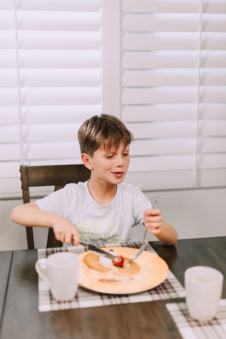 A Boy Eating Breakfast