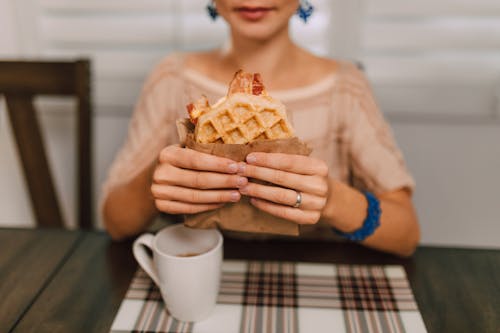 Free Person holding a Waffle Sandwich Stock Photo