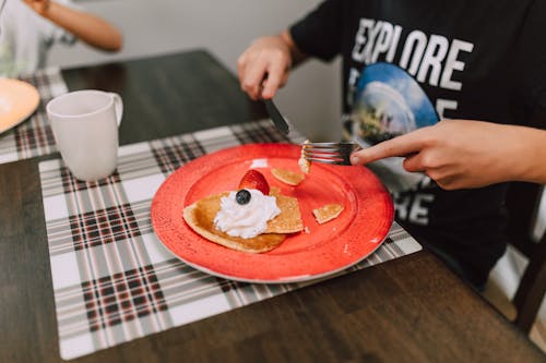 Pancake on a Red Ceramic Plate 