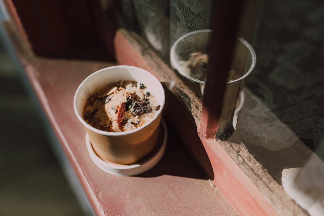 Free Disposable Cup filled with Oatmeal  Stock Photo