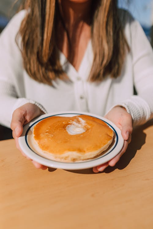 Free Person holding a Plate of Pancake  Stock Photo