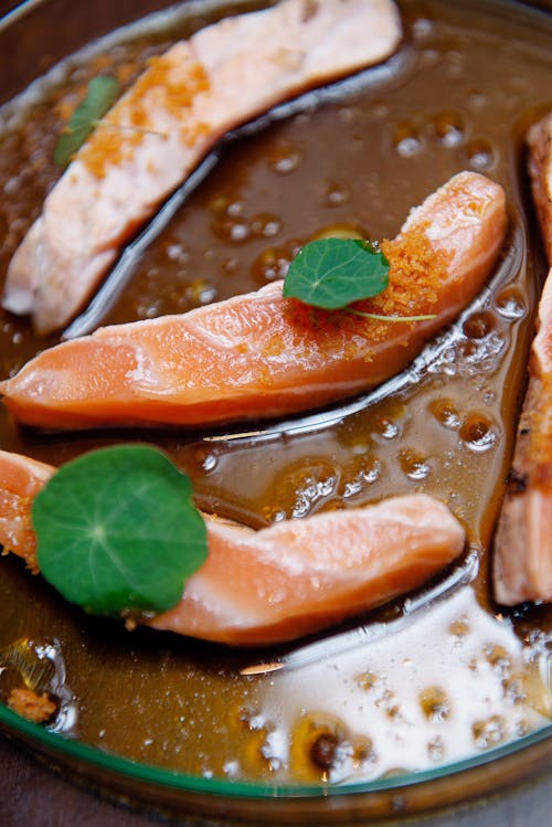 Free Close-up Photo of Fresh Sliced Salmon on a Thick Sauce  Stock Photo