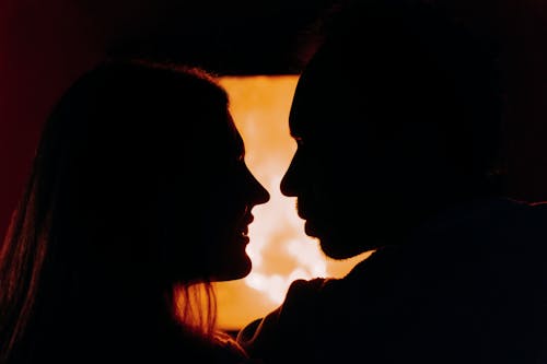 Silhouette Of Couple Looking At Each Other