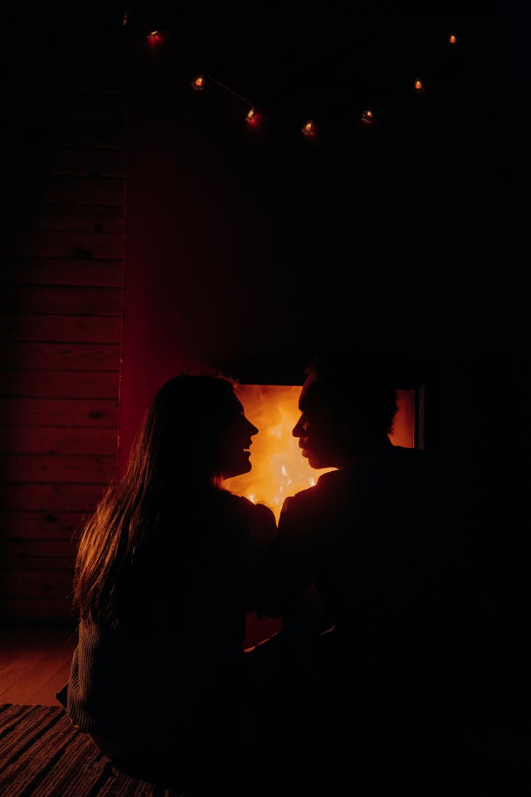 Silhouette Of Couple Looking At Each Other