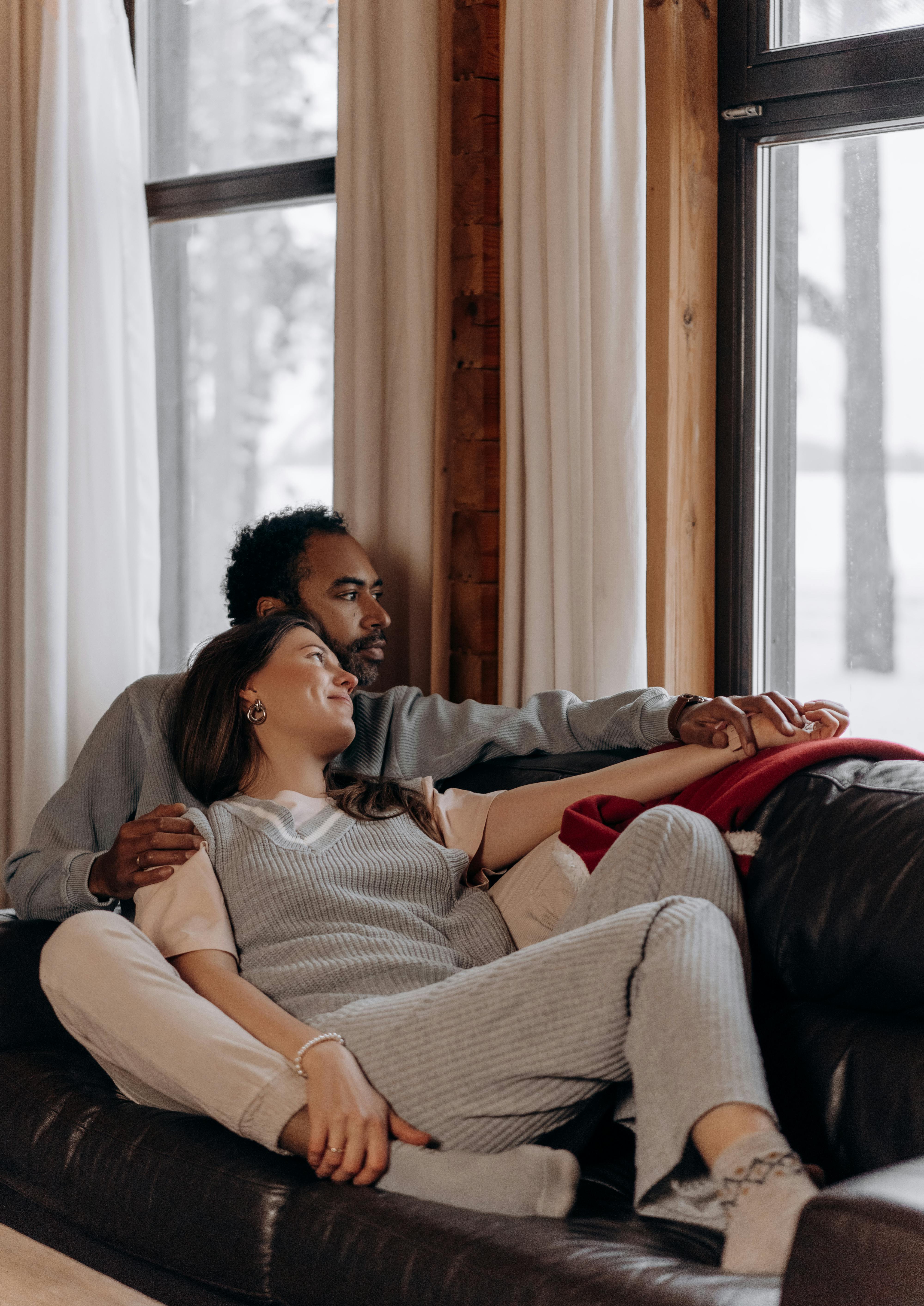 Love Couple Relaxing On Sofa Bed Stock Photo - Download Image Now - 25-29  Years, Adult, Adults Only - iStock