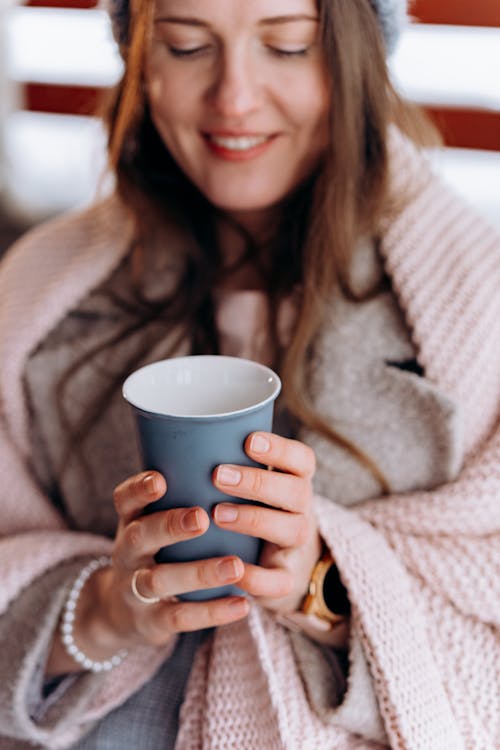 Free Relaxed Woman holding a Ceramic Cup  Stock Photo