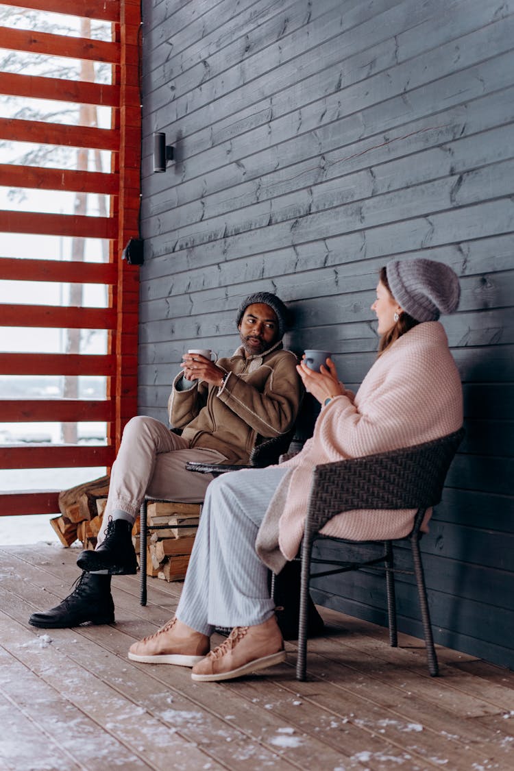 Relaxed Couple Sitting On Chairs