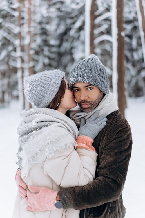 Free Woman in White Winter Coat and Gray Knit Cap Stock Photo