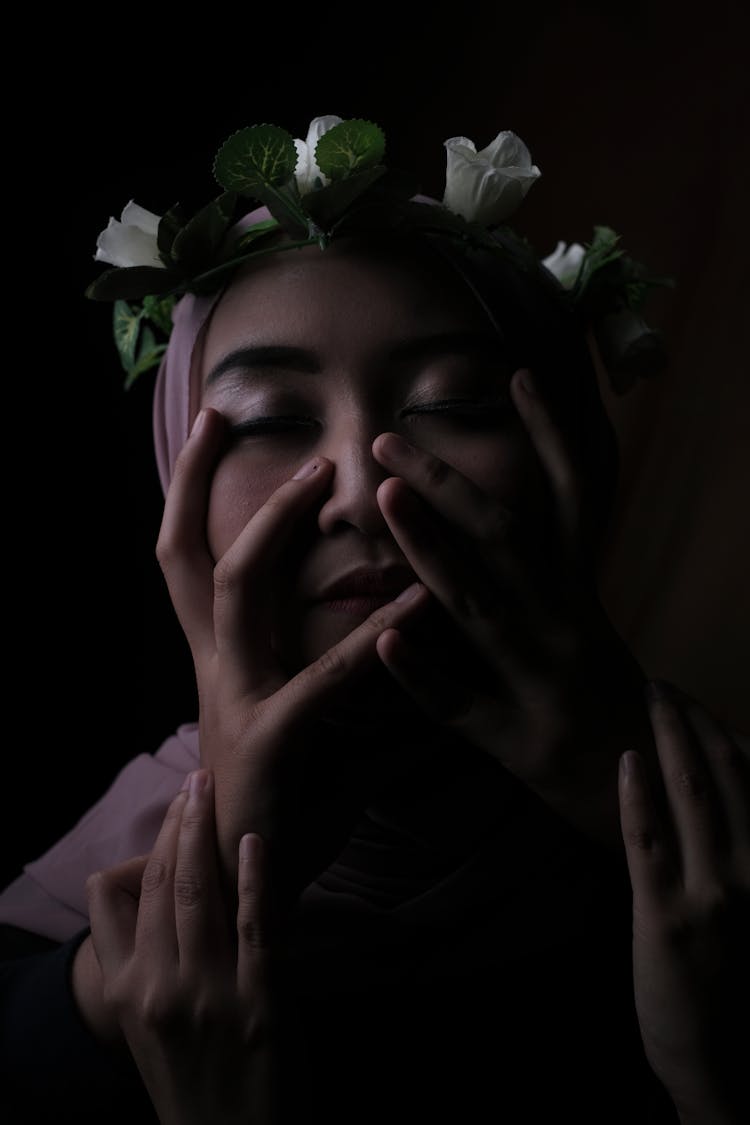 Calm Muslim Woman Touching Face With Closed Eyes