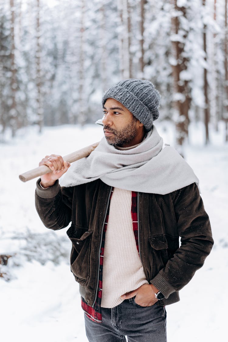 Photograph Of A Man Posing With An Axe