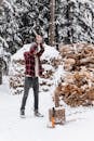 A Man Using an Axe to Chop Firewood