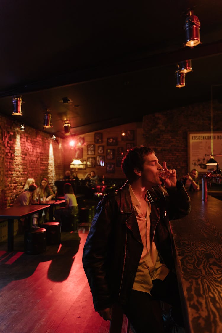 A Man Drinking In The Bar 