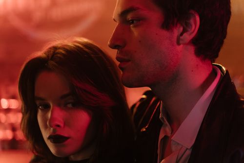 Free Close-up of a couple in a dimly lit setting, evoking a romantic and moody atmosphere. Stock Photo