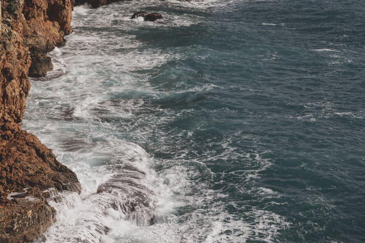 Ocean Waves Crashing On A Rocky Shore