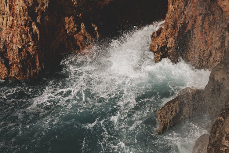 Sea Waves Crashing On Rocks