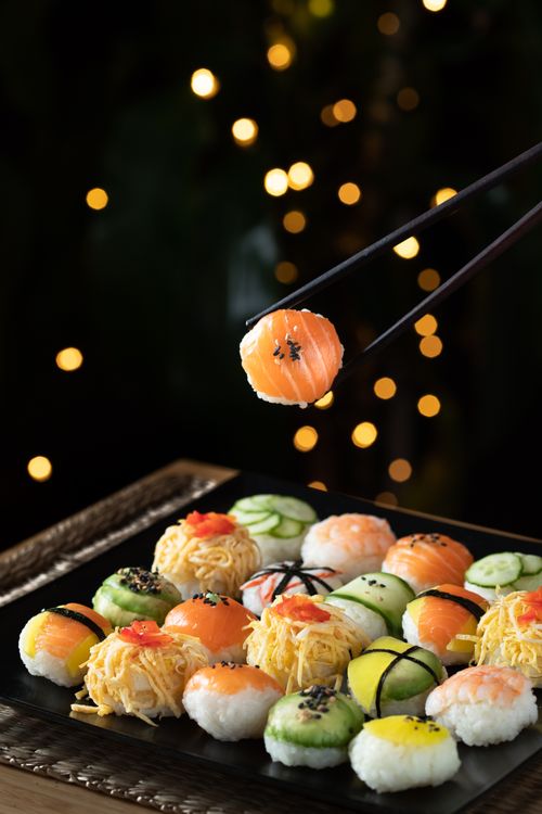 Free Delicious sushi assortment with salmon nigiri captured with bokeh background lighting. Stock Photo