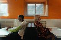 Man and Woman Sitting Back To Back Having A Fight