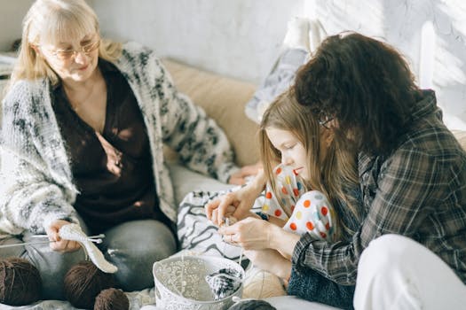A grandmother, mother, and child bond through knitting indoors on a cozy day.