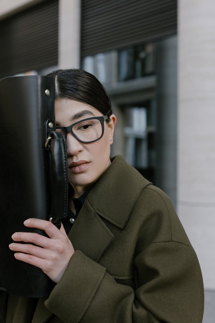 Pretty Woman Holding A Black Briefcase