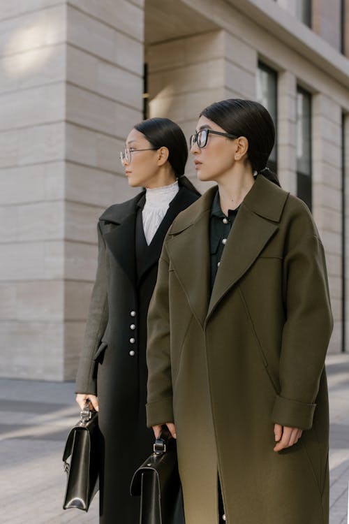 A Women in Coat Standing on Sidewalk · Free Stock Photo