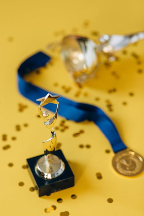 Free A Medal Beside the Trophy Stock Photo