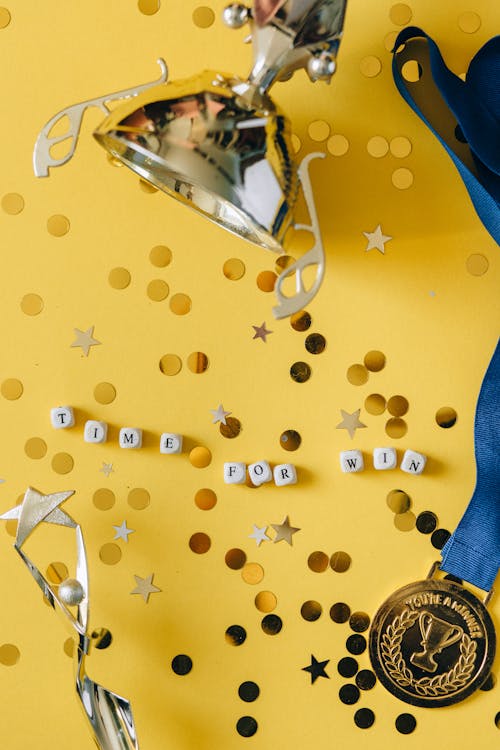 Free Medal on Ribbon, Golden Cup, Statuette and Dice with 'Time for Win' Message Stock Photo
