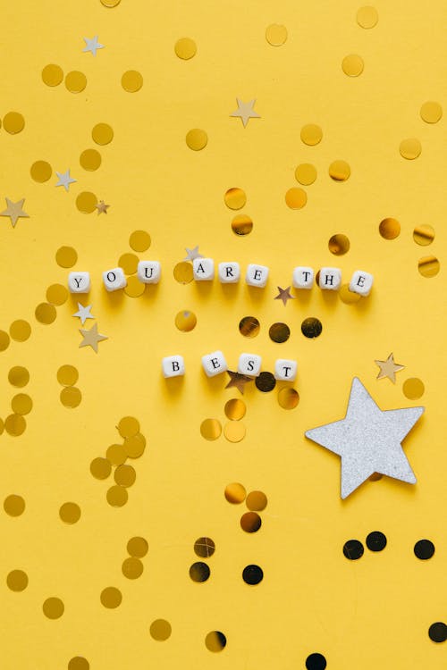Free Close-Up Shot of Dice on a Yellow Surface Stock Photo