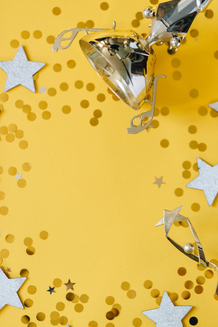 Golden Trophy And Silver Stars On Yellow Background