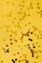 A Yellow Paperboard with Perforations of Round and Star Shaped Holes