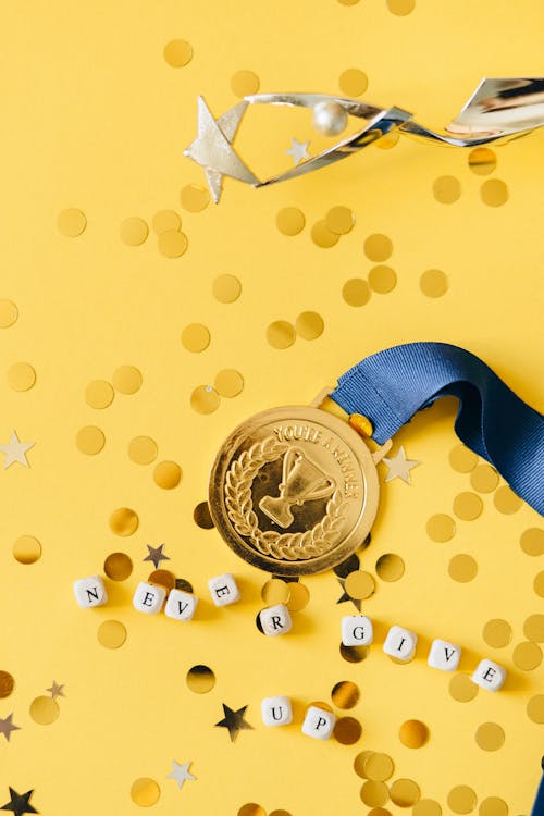 Free Medal on Blue Ribbon Beside Dices  Stock Photo