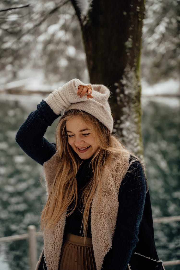 Woman In Knit Hat And Gloves Smiling