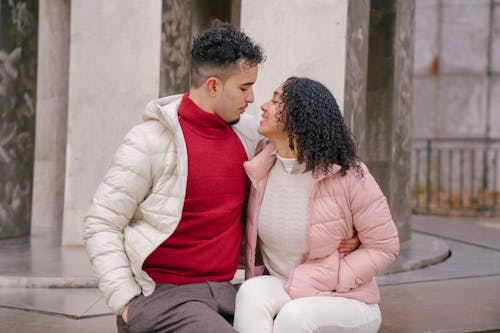 Free Loving ethnic couple hugging in park during romantic date Stock Photo