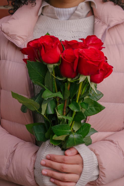 Crop Photo Of Woman Holding A Bunch Of Roses