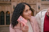 Ethnic woman getting box with surprise from boyfriend