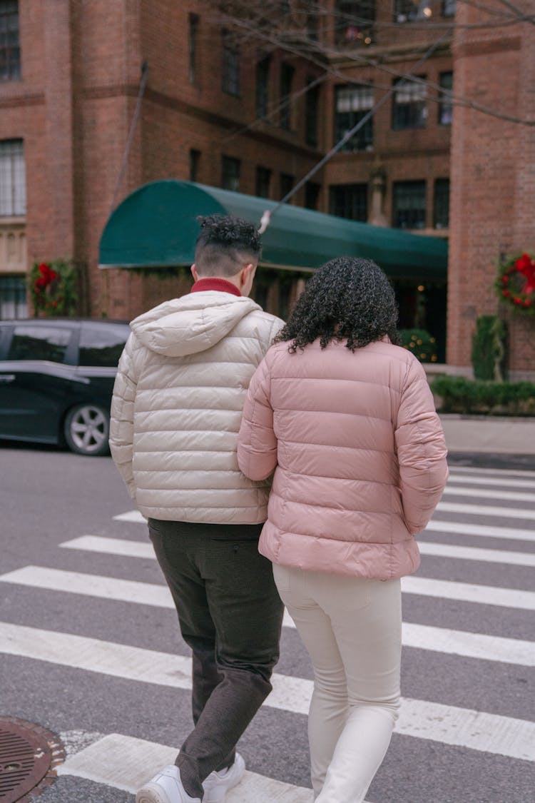 Couple Crossing City Street In Daytime