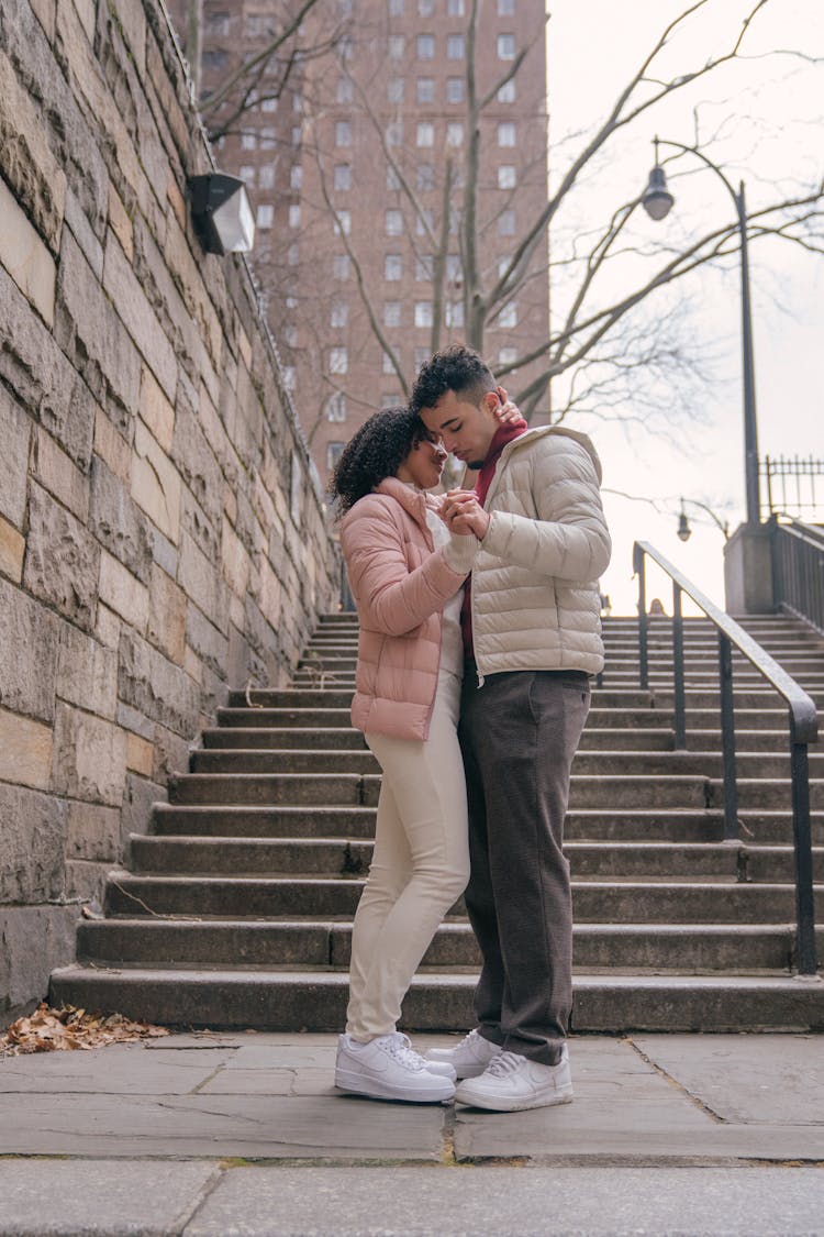 Tender Hispanic Couple Dancing On Street