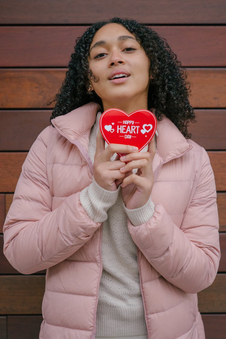 Content Hispanic Woman With Present In Hand